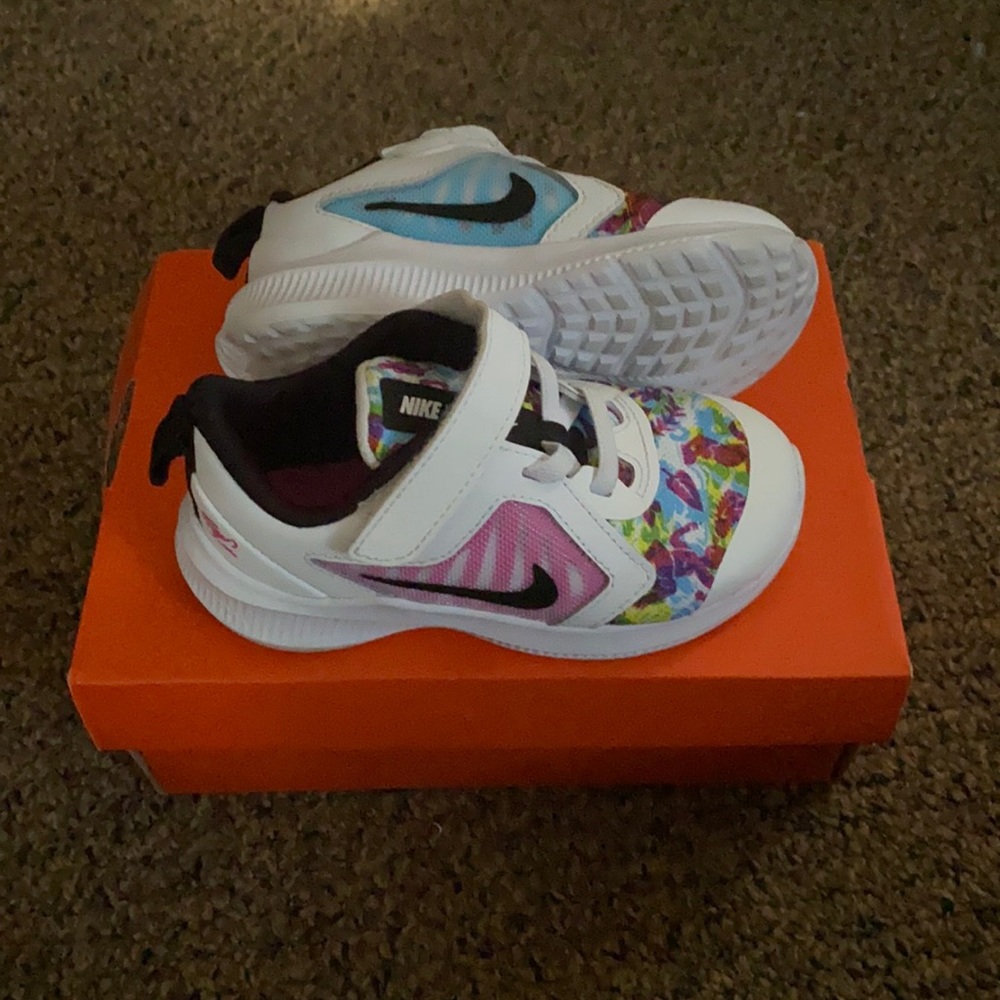 Size 7 Toddlers Girls pink, blue, and white Nikes